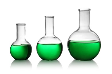 Photo of Florence flasks with green liquid on white background