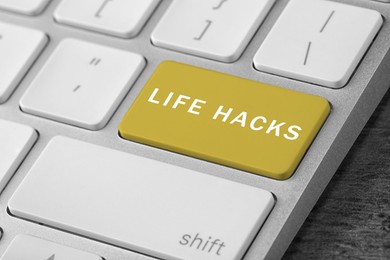 Image of Yellow button with words Life Hacks on computer keyboard, closeup