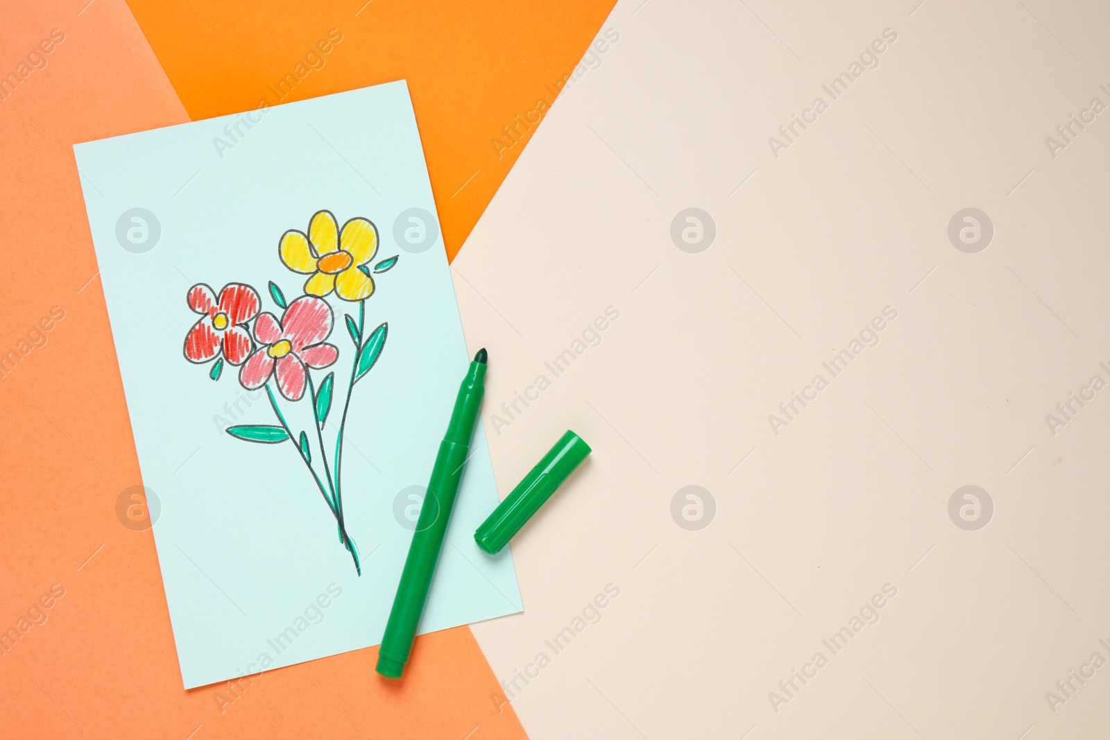 Photo of Top view of greeting card with drawn flowers and felt tip pen on color background, space for text. Happy mother's day