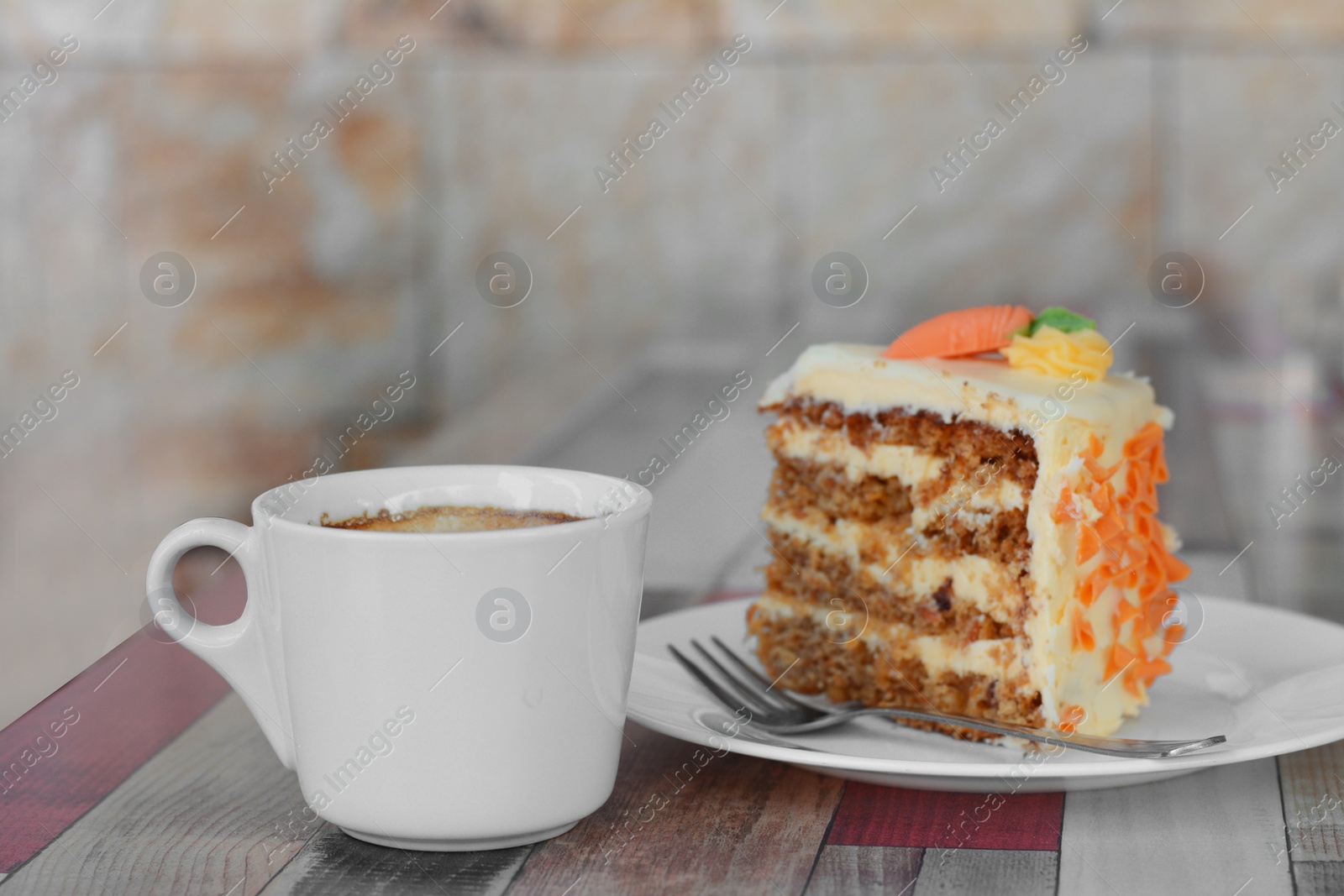 Photo of Delicious cake and cup of hot coffee on wooden table