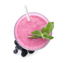 Tasty fresh milk shake with berries on white background, top view