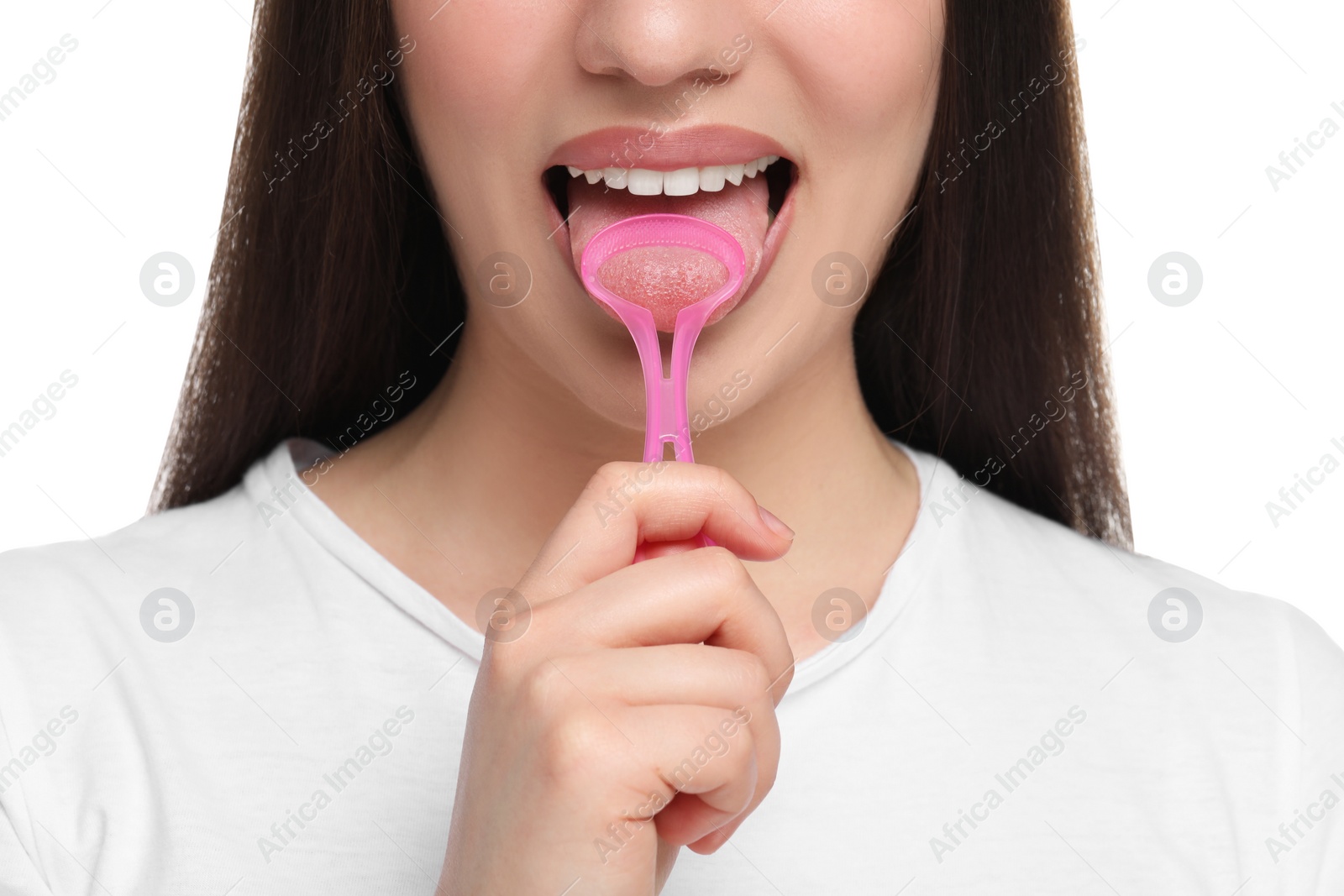 Photo of Woman brushing her tongue with cleaner on white background, closeup