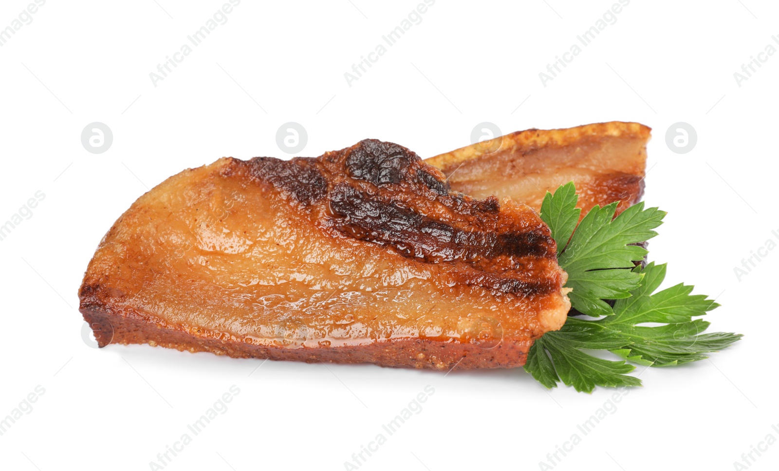 Photo of Tasty fried cracklings with parsley on white background. Cooked pork lard