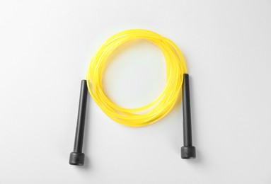 Skipping rope on white background, top view. Sports equipment