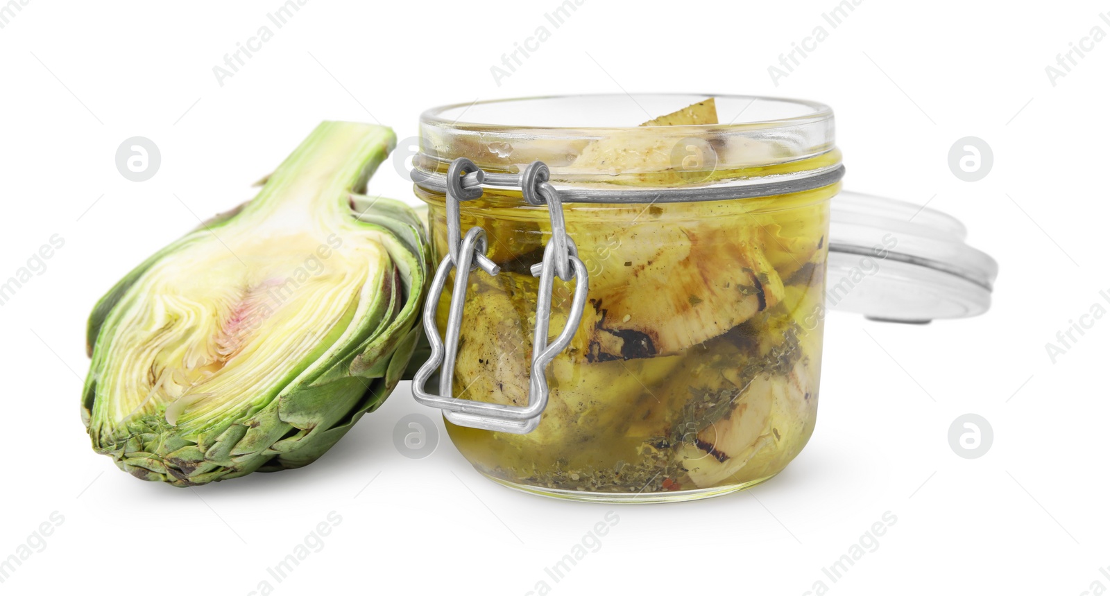 Photo of Open jar of delicious artichokes pickled in olive oil and fresh vegetable on white background