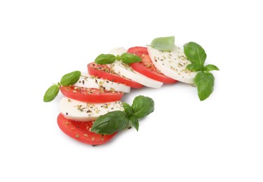 Photo of Tasty salad Caprese with mozzarella, tomatoes, basil and spices on white background