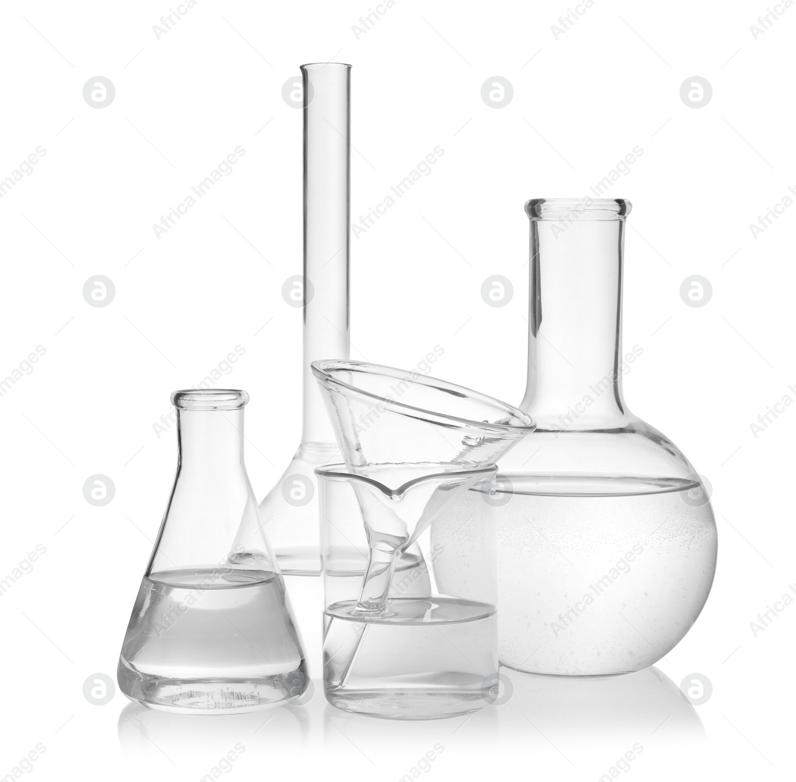 Photo of Laboratory glassware with transparent liquid on white background