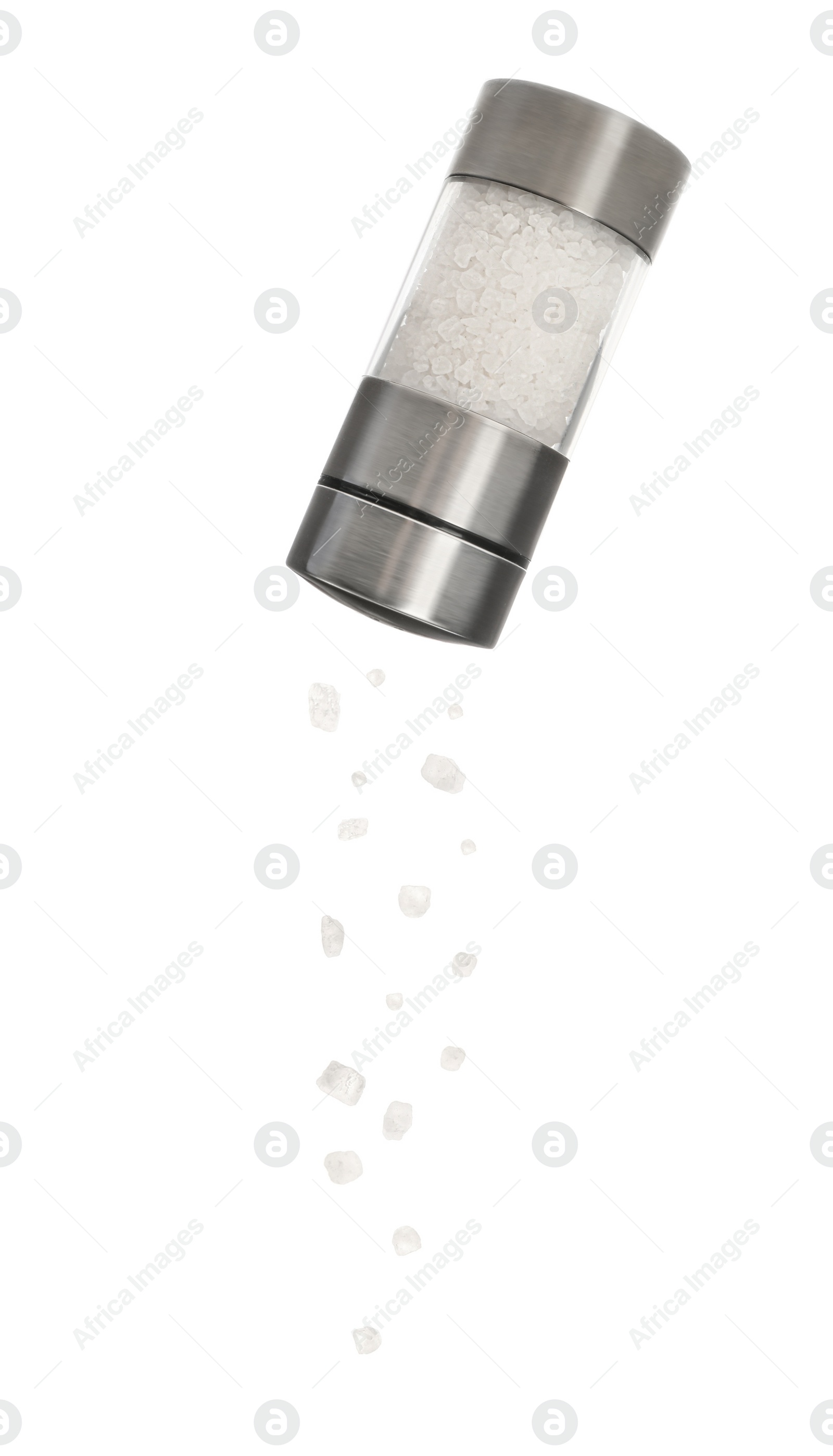 Image of Salt crystals falling from shaker on white background