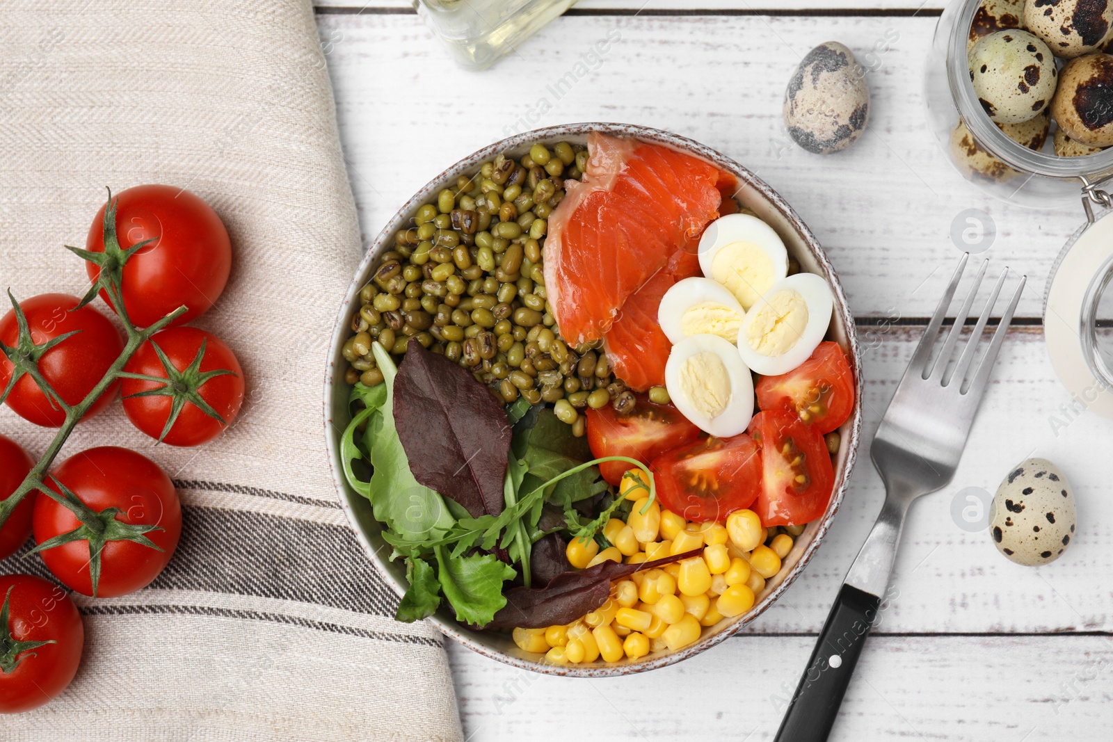 Photo of Bowl of salad with mung beans on white wooden table, flat lay