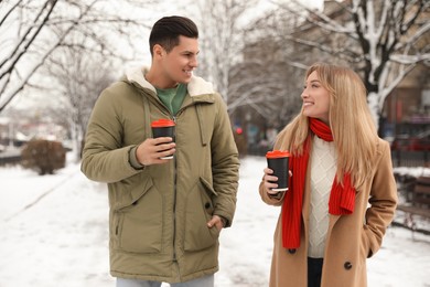 Beautiful happy couple outdoors on winter day