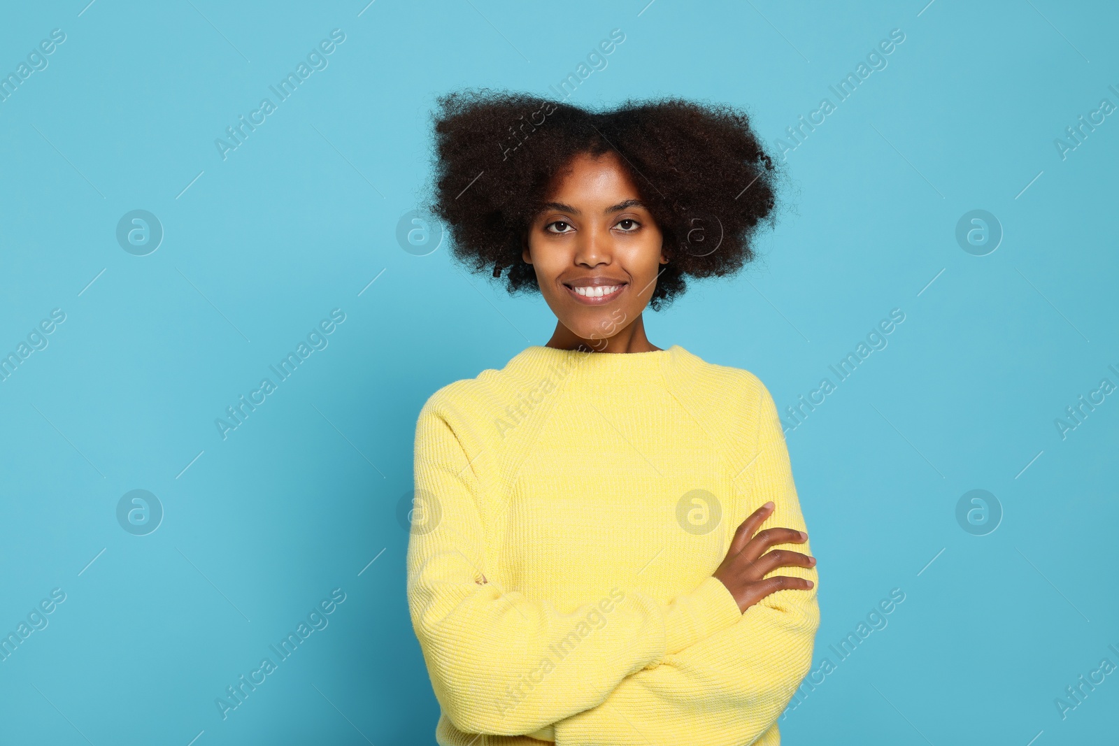 Photo of Portrait of smiling African American woman on light blue background