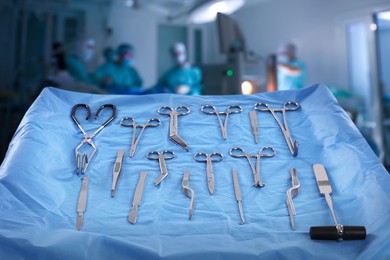 Image of Different surgical instruments on table in operating room