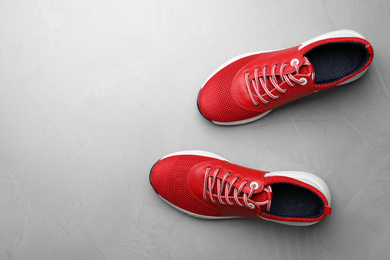 Pair of stylish shoes on grey background, top view. Space for text