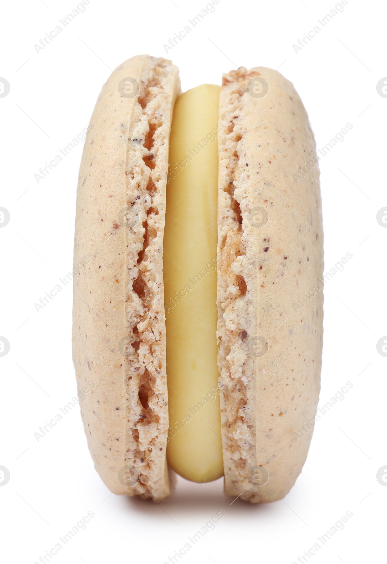 Photo of Beige macaron isolated on white. Delicious dessert