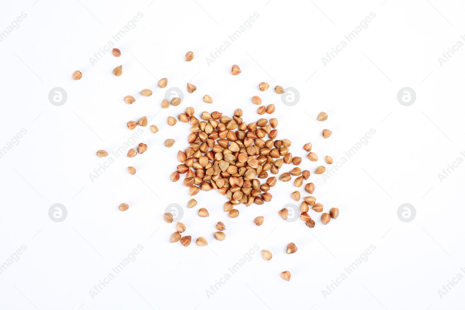 Photo of Uncooked buckwheat on white background, top view