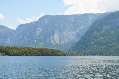 Picturesque view of river and mountains on sunny day