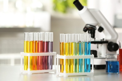 Test tubes with color liquids on table in laboratory