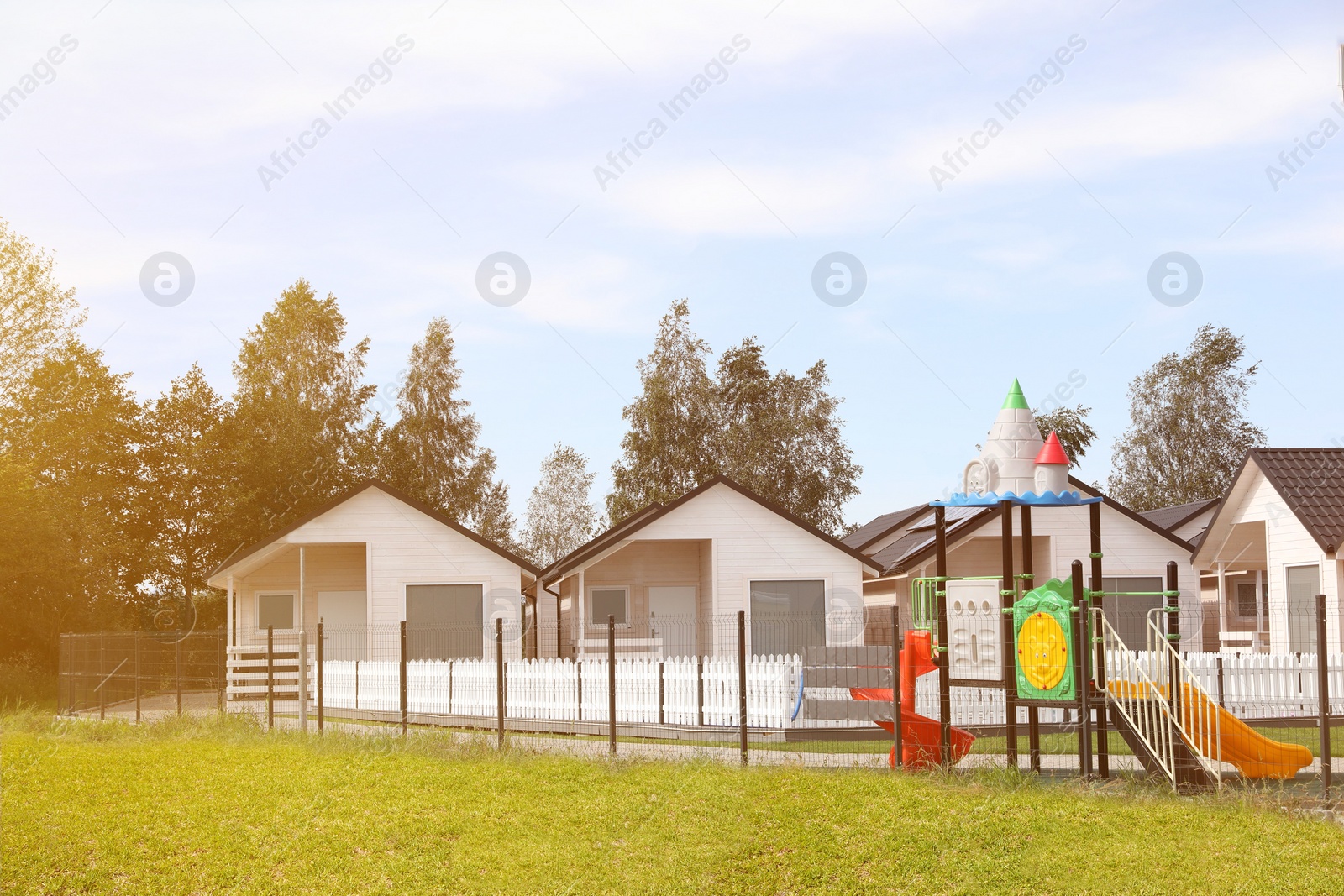 Photo of Beautiful view of modern houses and playground outdoors