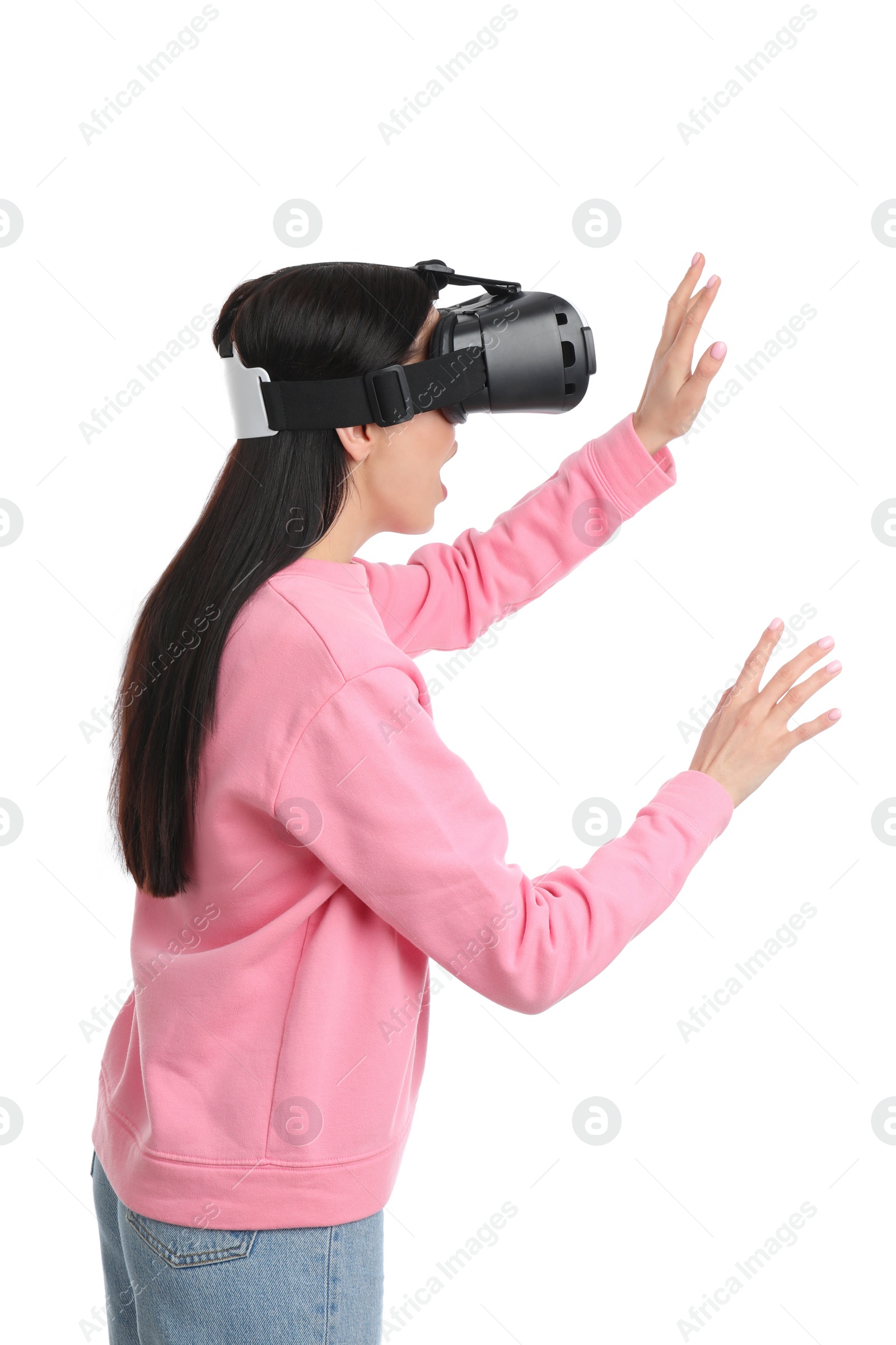 Photo of Woman using virtual reality headset on white background