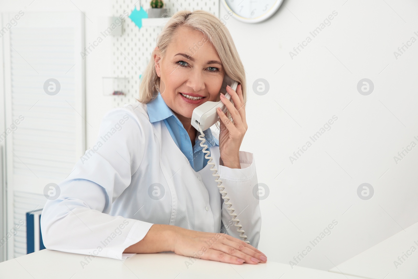 Photo of Senior female receptionist working in hospital