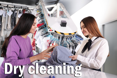 Image of Worker receiving clothes from client at dry-cleaner's