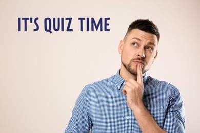 Image of Thoughtful man and phrase IT'S QUIZ TIME on white background 