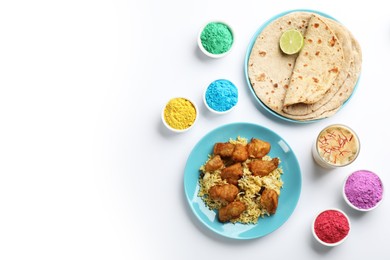 Flat lay of traditional Indian food and color powder dyes on light background, space for text. Holi festival