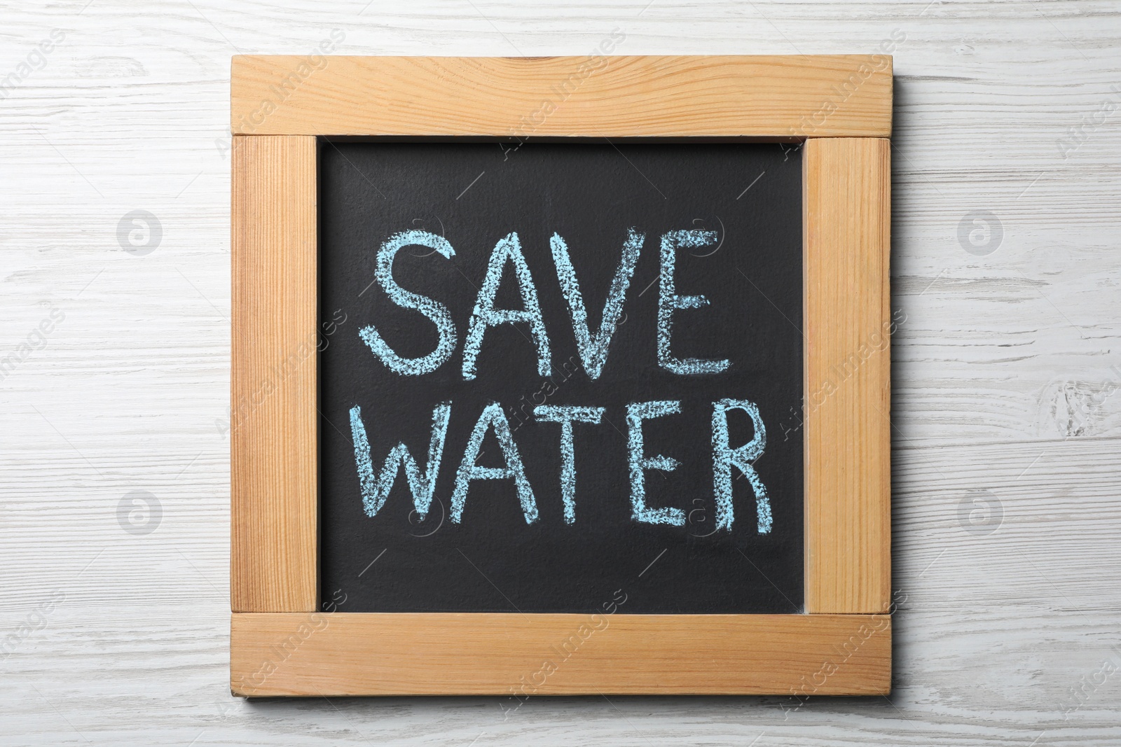 Photo of Blackboard with words Save Water on white wooden table, top view