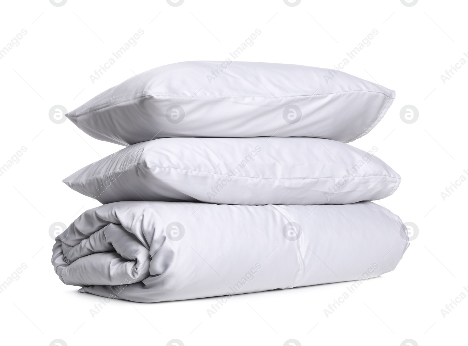 Photo of Stylish silky bed linens and pillows on white background