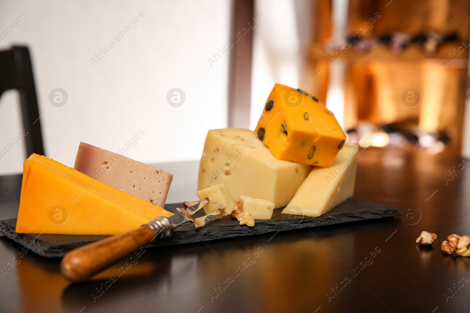 Photo of Different types of cheeses served on table, closeup