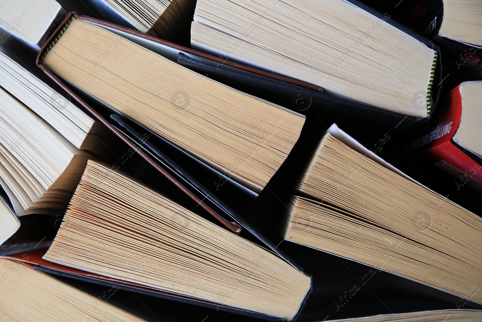 Photo of Collection of different books as background, top view