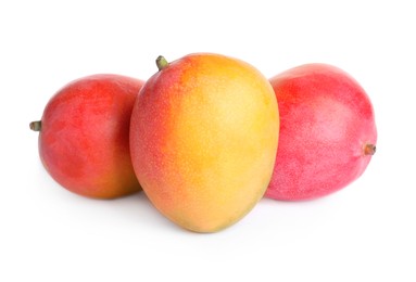 Delicious ripe juicy mangoes on white background