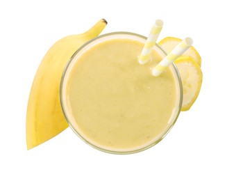 Glass of tasty banana smoothie with straws and fresh fruit on white background, top view