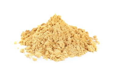 Photo of Heap of aromatic mustard powder on white background