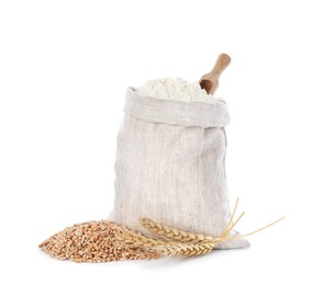 Photo of Sack with flour, wheat grains and spikes on white background