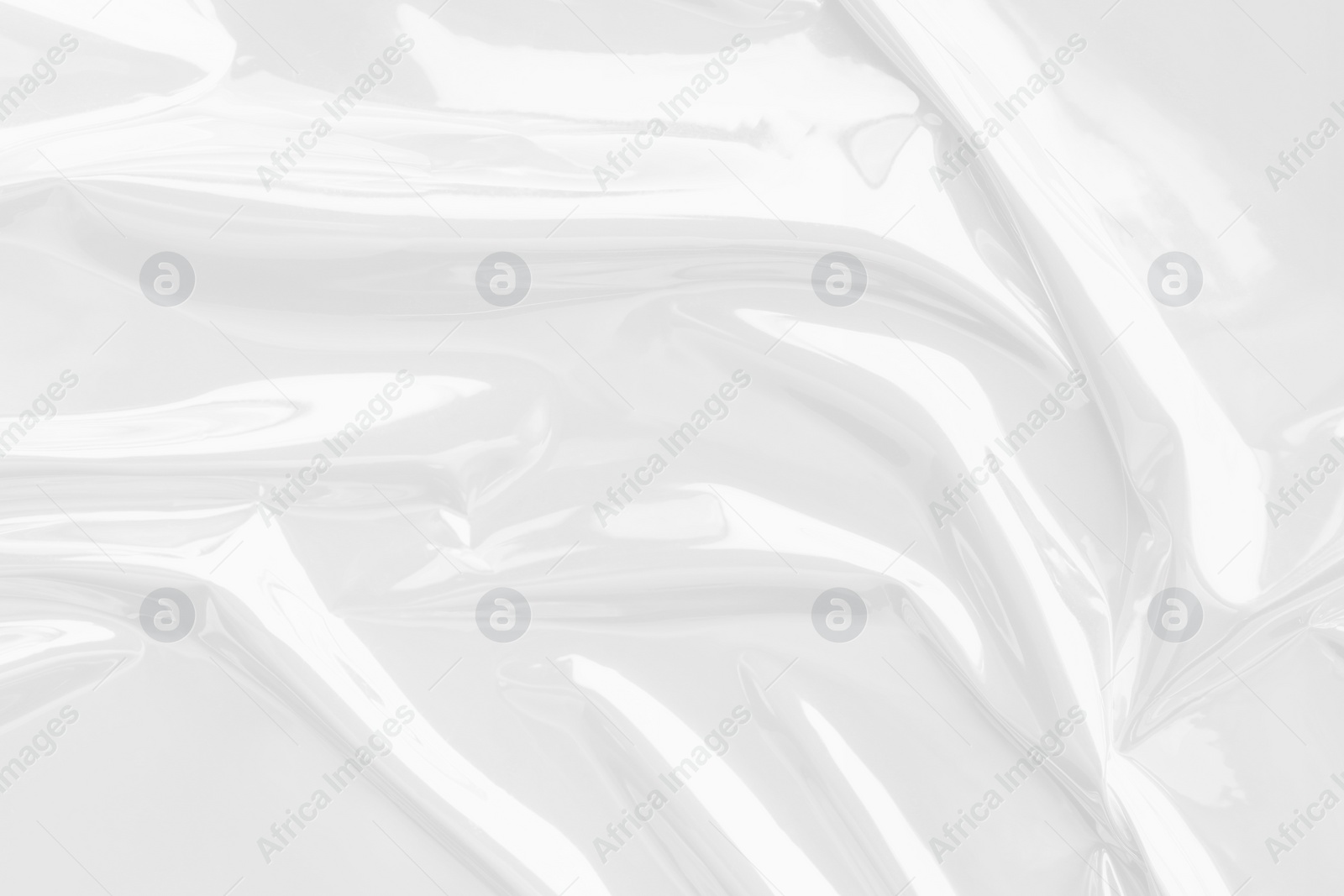 Image of Crumpled white foil film as background, closeup view