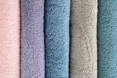 Photo of Clean soft terry towels as background, closeup