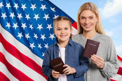 Immigration. Happy woman and her daughter with passports and national flag of United States against blue sky, space for text