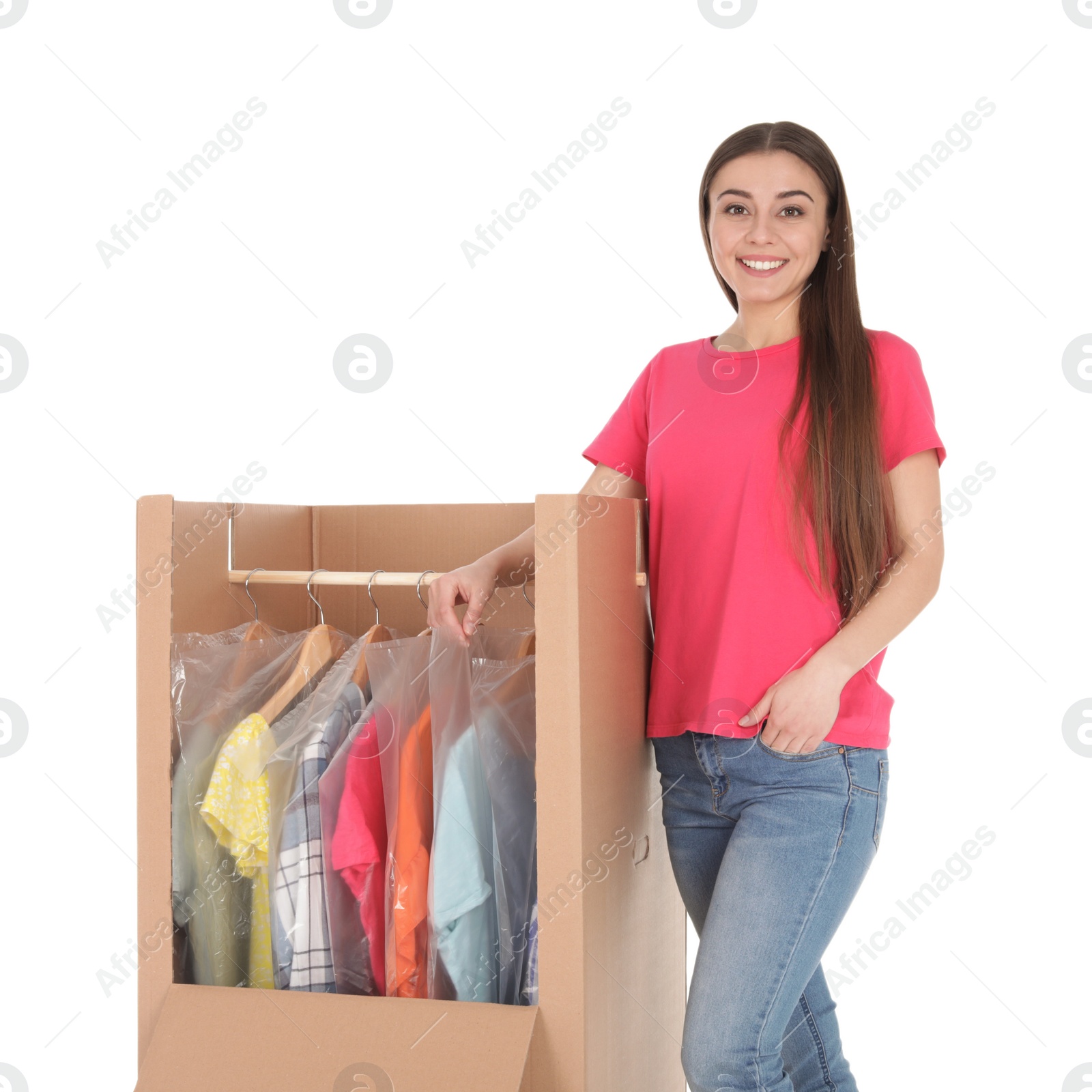 Photo of Young woman near wardrobe box on white background