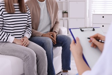 Couple having appointment with STD specialist in clinic, closeup