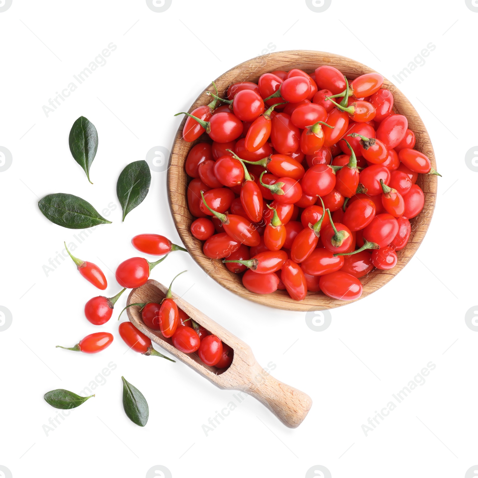 Photo of Fresh ripe goji berries, bowl and scoop on white background, top view