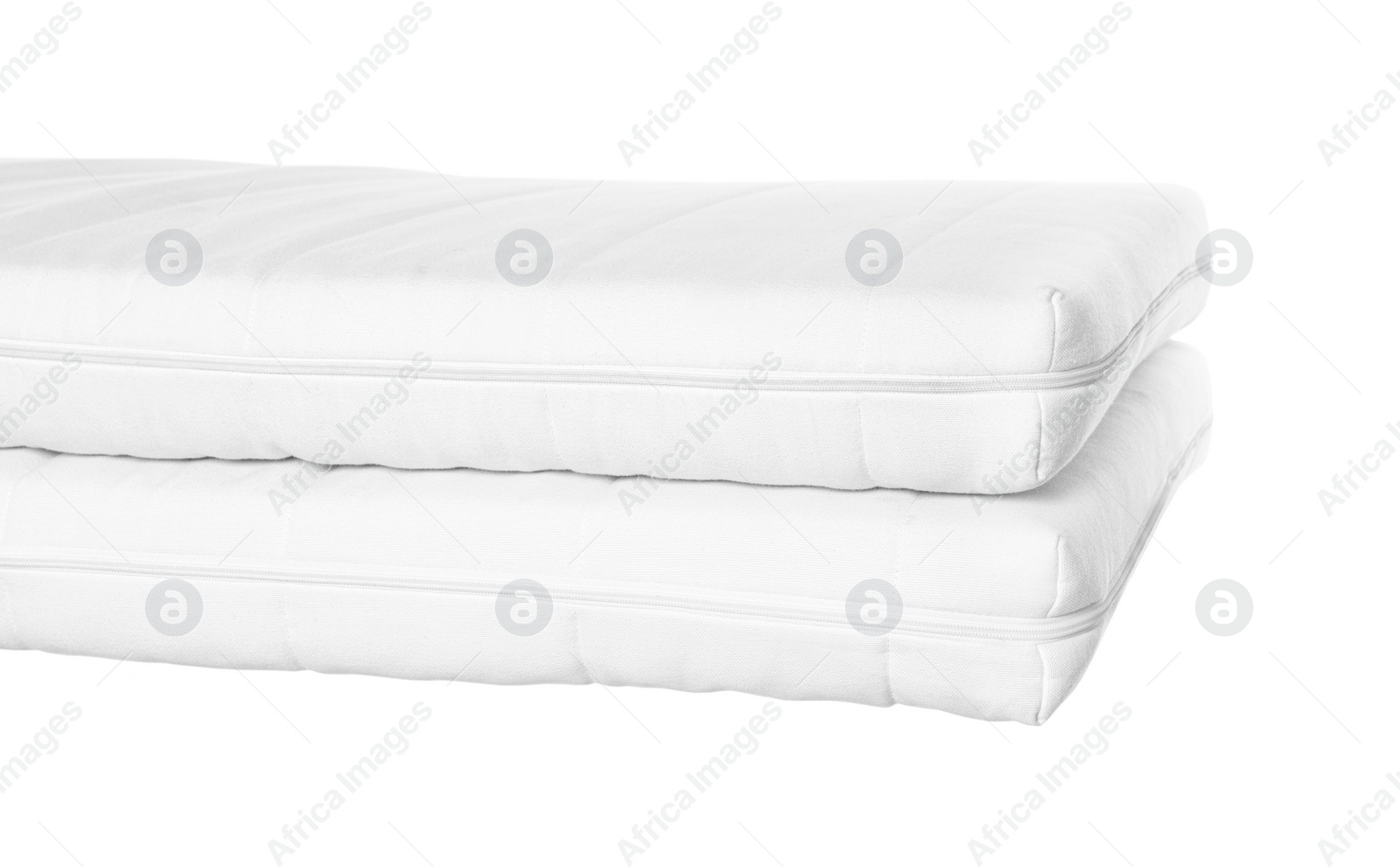 Photo of Two new comfortable mattresses isolated on white, closeup