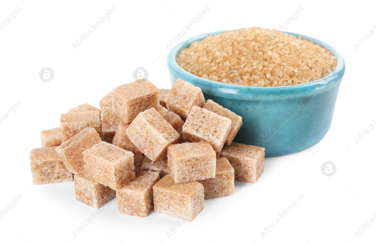 Photo of Different types of brown sugar and bowl isolated on white