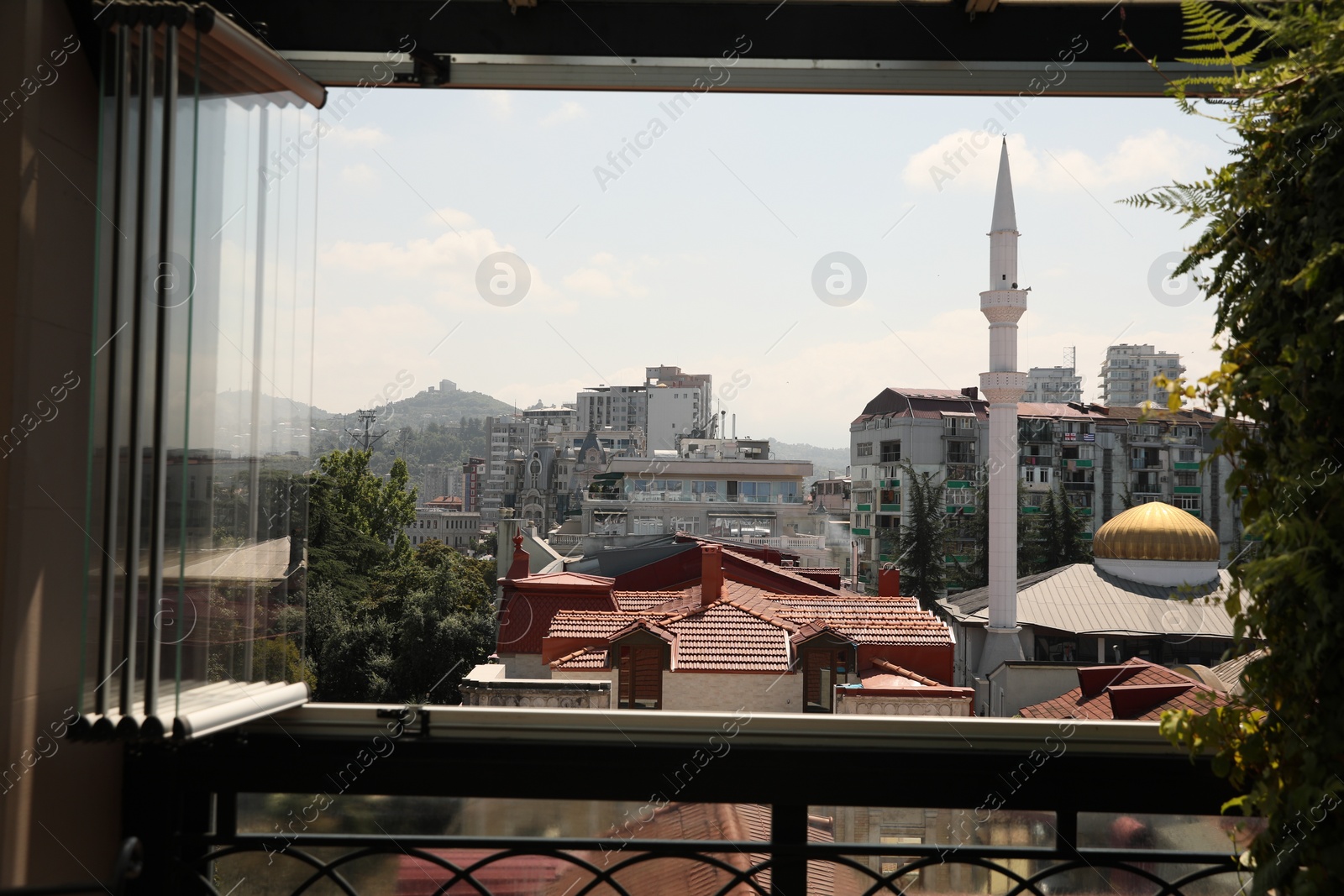 Photo of BATUMI, GEORGIA - AUGUST 28, 2022: Cityscape with modern buildings, view from window