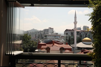 BATUMI, GEORGIA - AUGUST 28, 2022: Cityscape with modern buildings, view from window