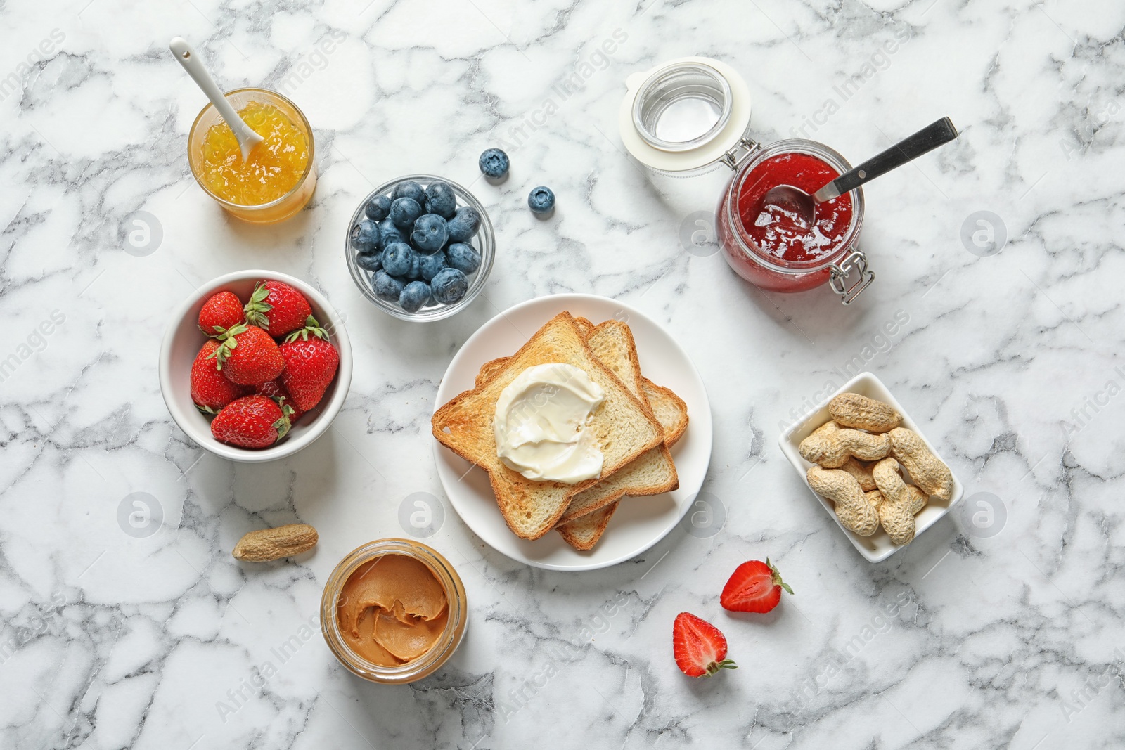 Photo of Flat lay composition with toast bread and toppings on marble background