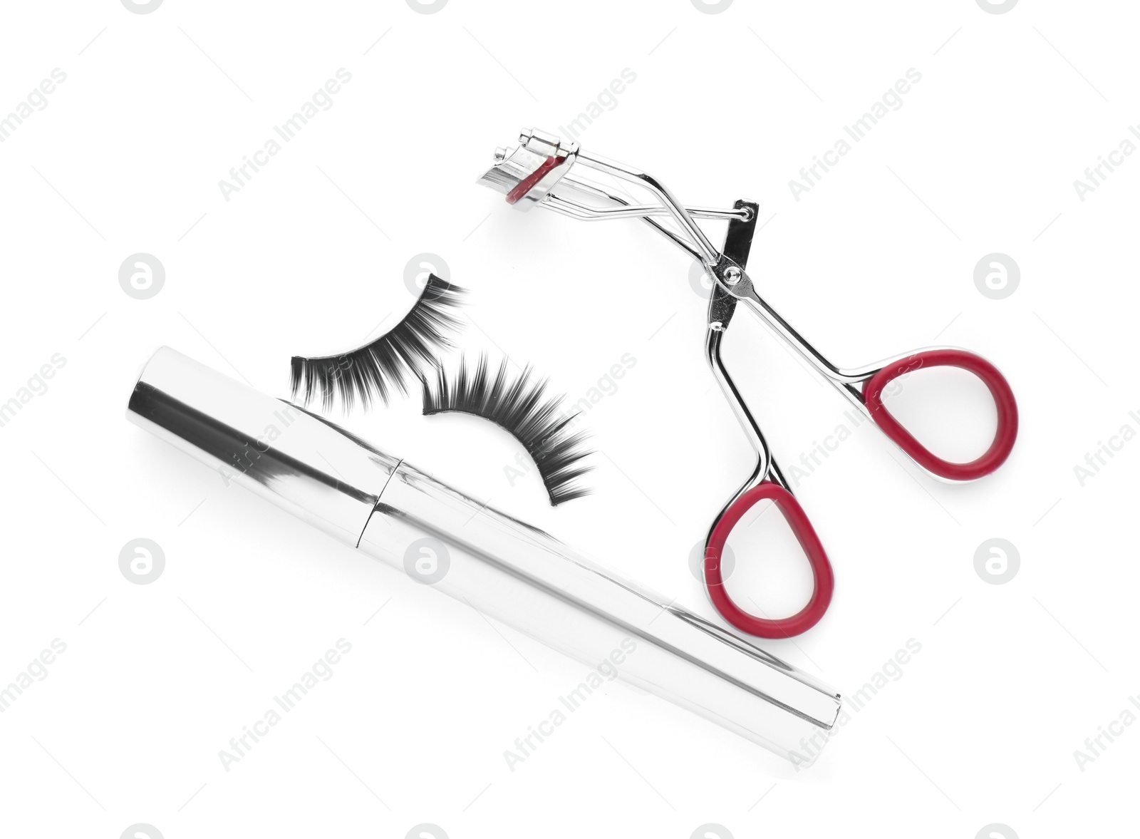 Photo of False eyelashes, curler and mascara on white background, top view