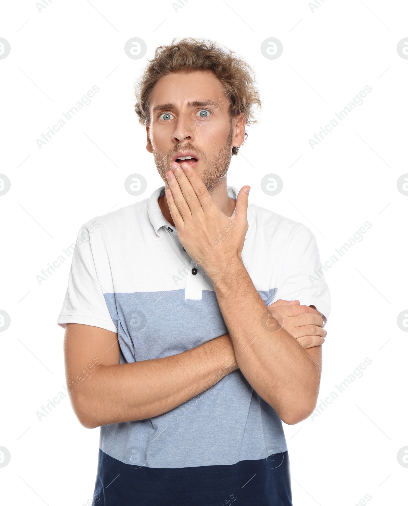 Photo of Young man in casual clothes posing on white background