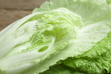 Photo of Cut fresh Chinese cabbage on table, closeup