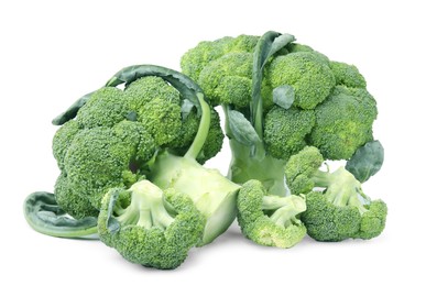 Photo of Pile of fresh raw green broccoli isolated on white